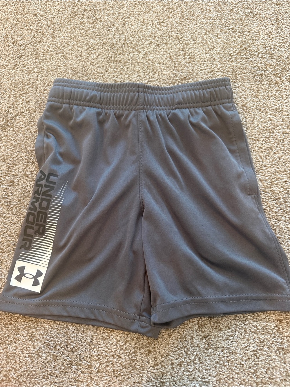 Under Armour kids 
Youth Small shorts with pockets